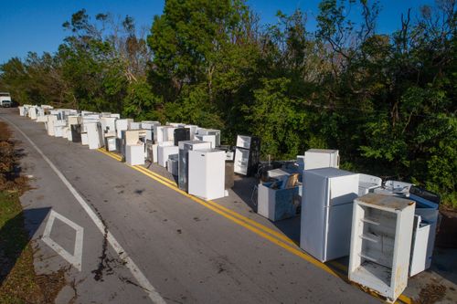 old appliances outside in street before trash pickup